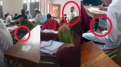 বরগুনায় দাখিল পরীক্ষায় মোবাইল দেখে উত্তর লেখার ভিডিও ভাইরাল