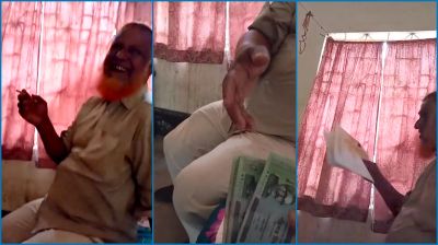 সিগারেট টানতে টানতে নিচ্ছেন ঘুষ, ভিডিও ভাইরাল